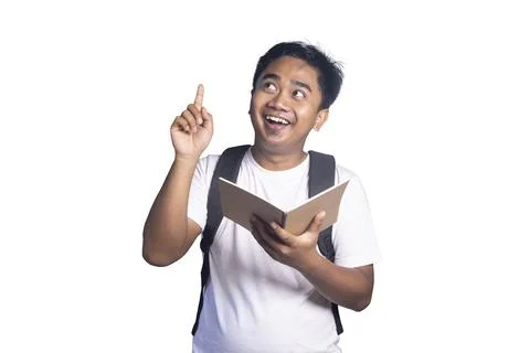 Young man with a backpack holding an open notebook and pointing upwards wit.. Stock Photos