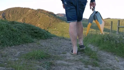 Young man with backpack walking on paths Stock Footage 130854784