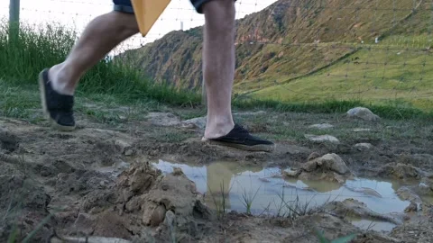 Young man with backpack walking on paths Stock Footage 130857095