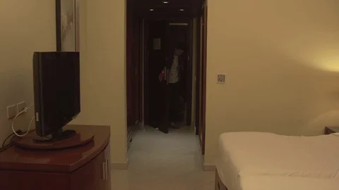 Young man with baggage Check in hotel room 스톡 동영상 73975892