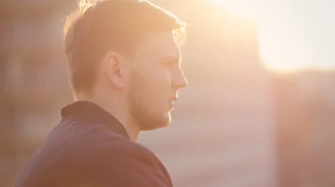 Young man on the balcony watching the sunset. Close up Stock Footage 61843861