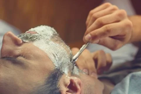 Young man at the barber Foto stock