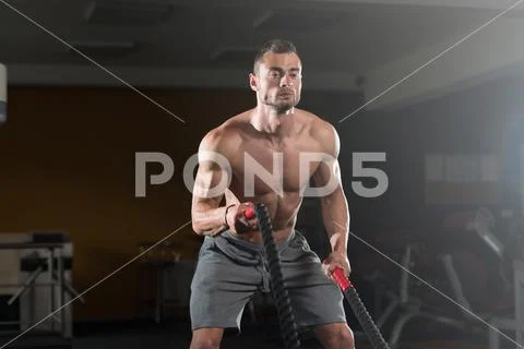 Premium Photo  Young fit man with sunglasses working out in the