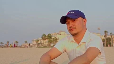 Young man at the beach Stock Footage 224277778