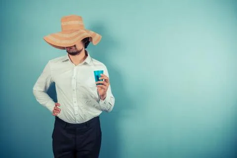 Young man with a beach hat Photos