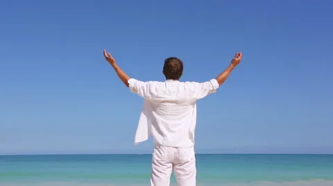 Young man on beach hold hands arms up Vacation concept of freedom travel Stock Footage 62907560