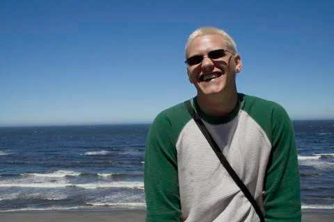 Young man at the beach Stock Photos