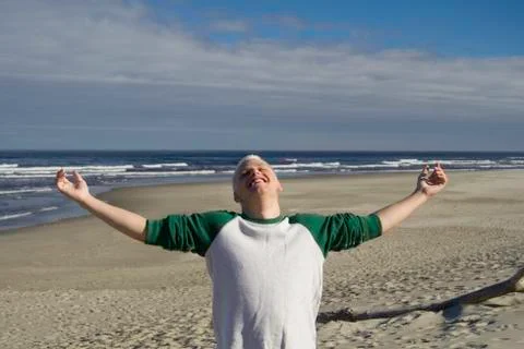 Young man at the beach Stock Photos