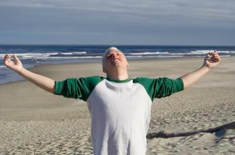 Young man at the beach Stock Photos