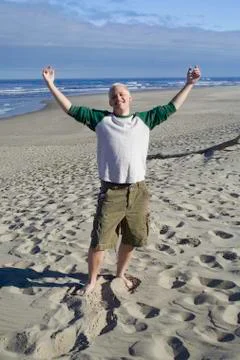 Young man at the beach Stock Photos