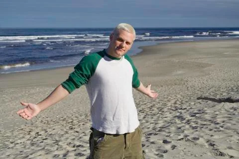 Young man at the beach Stock Photos