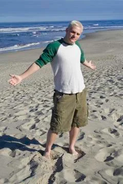 Young man at the beach Stock Photos