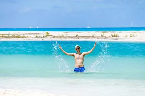 Young man on the beach Stock Photos
