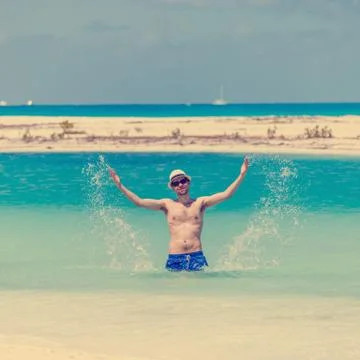 Young man on the beach Stock Photos