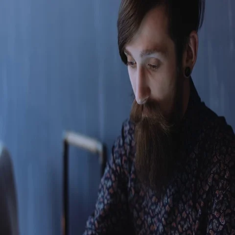 Young man with bear using tablet Stock Footage 69290998