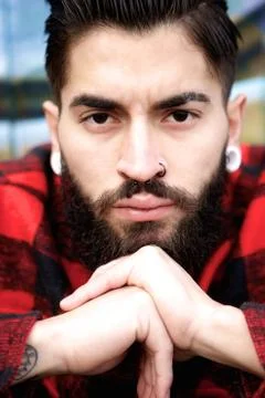 Young man with beard and piercing Stock Photos