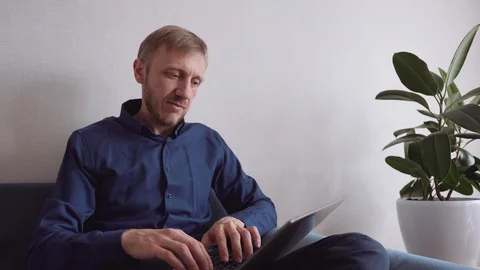 Young man with a beard communicates by video link Stock-Footage 128298495