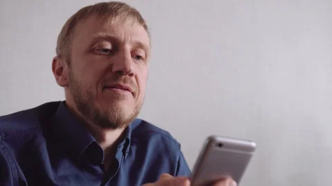 Young man with a beard communicates by video link Stock Footage 128300754