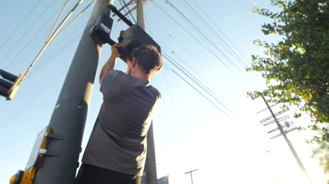 A young man with a beard doing pull-ups in urban environment. Stock Footage 67981424