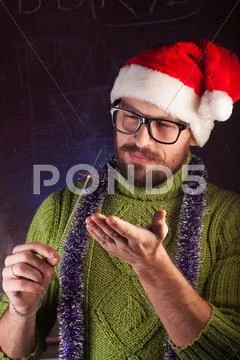 Young man with beard in a green knitted sweater Stock Photos