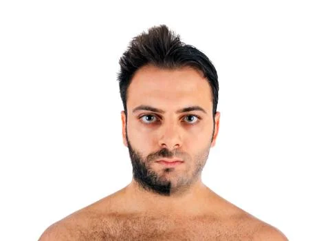 A young man with a beard on half of the face Stock Photos