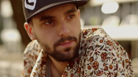 Young man with a beard looking around Stock Footage 61273919