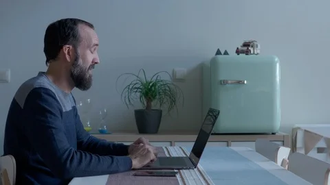 Young man with a beard making a video conference Stock Footage 122389638