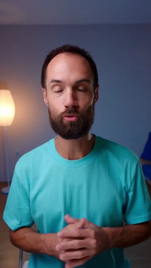 Young man with a beard records a vlog on camera Stock Footage 248470174