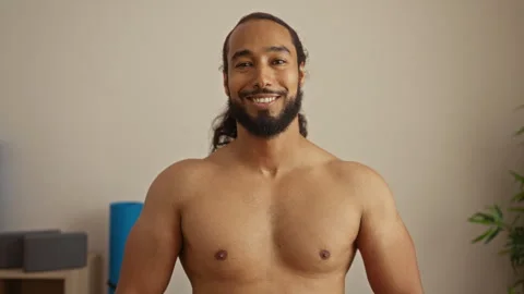 Young man with beard smiling in spa salon wellness room showcasing relaxati.. Stock Footage 301666791