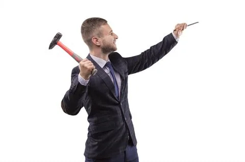 Young man beats hammer on the chisel Stock-Fotos