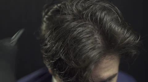 Young man in beauty salon having his hair dried Stock Footage 56925448