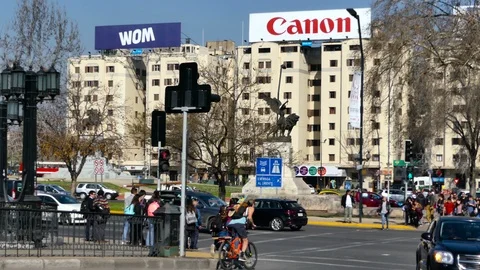 Young man on bicycle and crowd of pedestrians Stock Footage 97085249