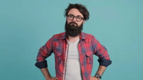 Young man with big beard with bad attitude making stop sign crossing hands. Stock Footage 139646497