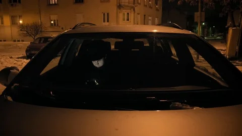 A young man in a black hat uses the phone in car. 4k Stock-Footage 103365458