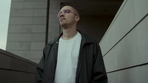 Young man in black jacket thinking 스톡 동영상 258272557