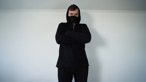 Young man in black shows gesture of a gun with your hand Video stock 129555545