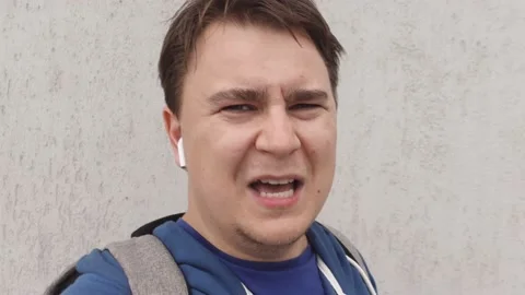 Young man blogger broadcasts stream to subscribers outdoors Stock Footage 161444522