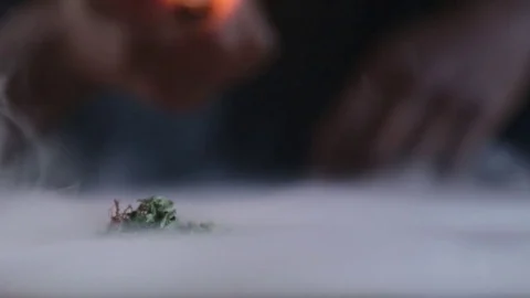 Young Man Blows Marijuana Smoke on Table Stock Footage 78187526