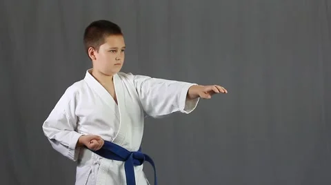Young man with a blue belt does strike Stock Footage 41004976