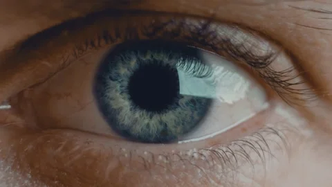 Young man blue iris eye widens in fear. Healthy eyesight concept. Front view Stock Footage 136472328