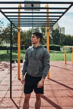 Young man bodybuilder having break during his workout in a modern calisthenic Stock Photos