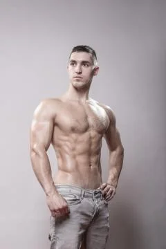 Young man bodybuilder ripped posing upper body. Stock Photos