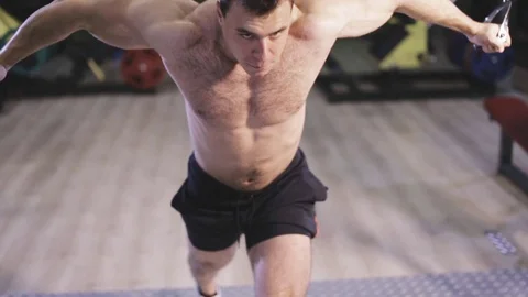 Young Man Bodybuilder Is Working On His Chest With Cable Stock Footage 80983600