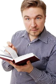 Young man with a book Stock Photos