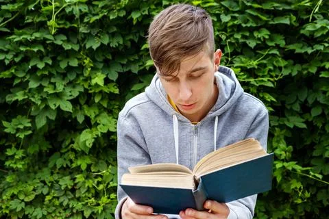 Young Man with a Book Stock Photos