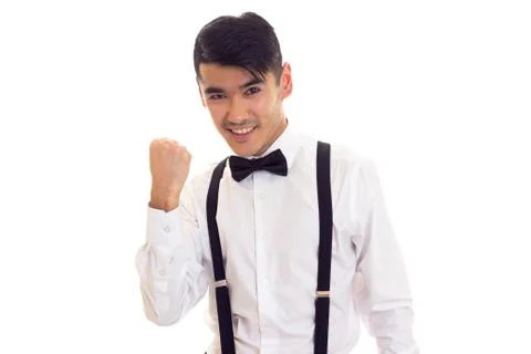 Young man with bow-tie and suspenders Stock Photos