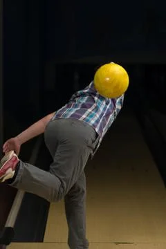 Young man bowling Stock Photos