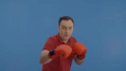 Young man boxing alone with gloves. Stock Footage 148260257