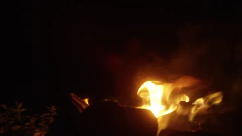 Young Man Boxing and Training by the Campfire at Night Stock Footage 314644460