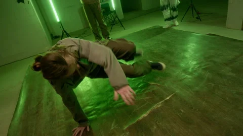 Young Man Breakdancing in front of Young Colleagues Video stock 300845058
